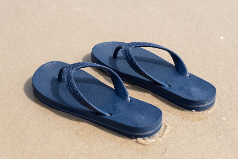 plain flip-flops on sand