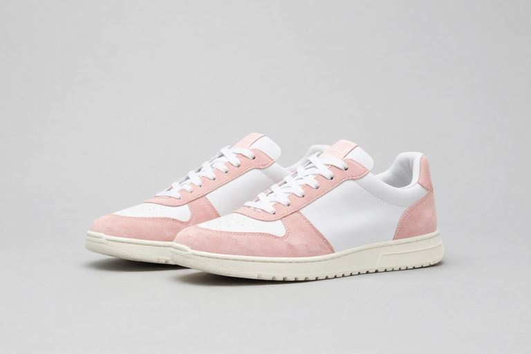 A pair of large white and pink women's trainers